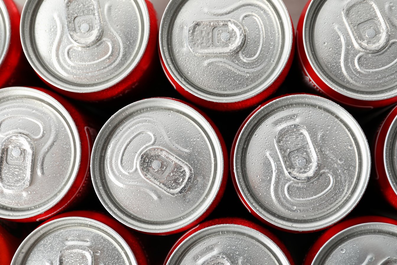 Cans with Soda All over Background, Close up